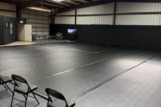The main mat at 13th Chamber, looking toward the entrance and viewing chairs.
